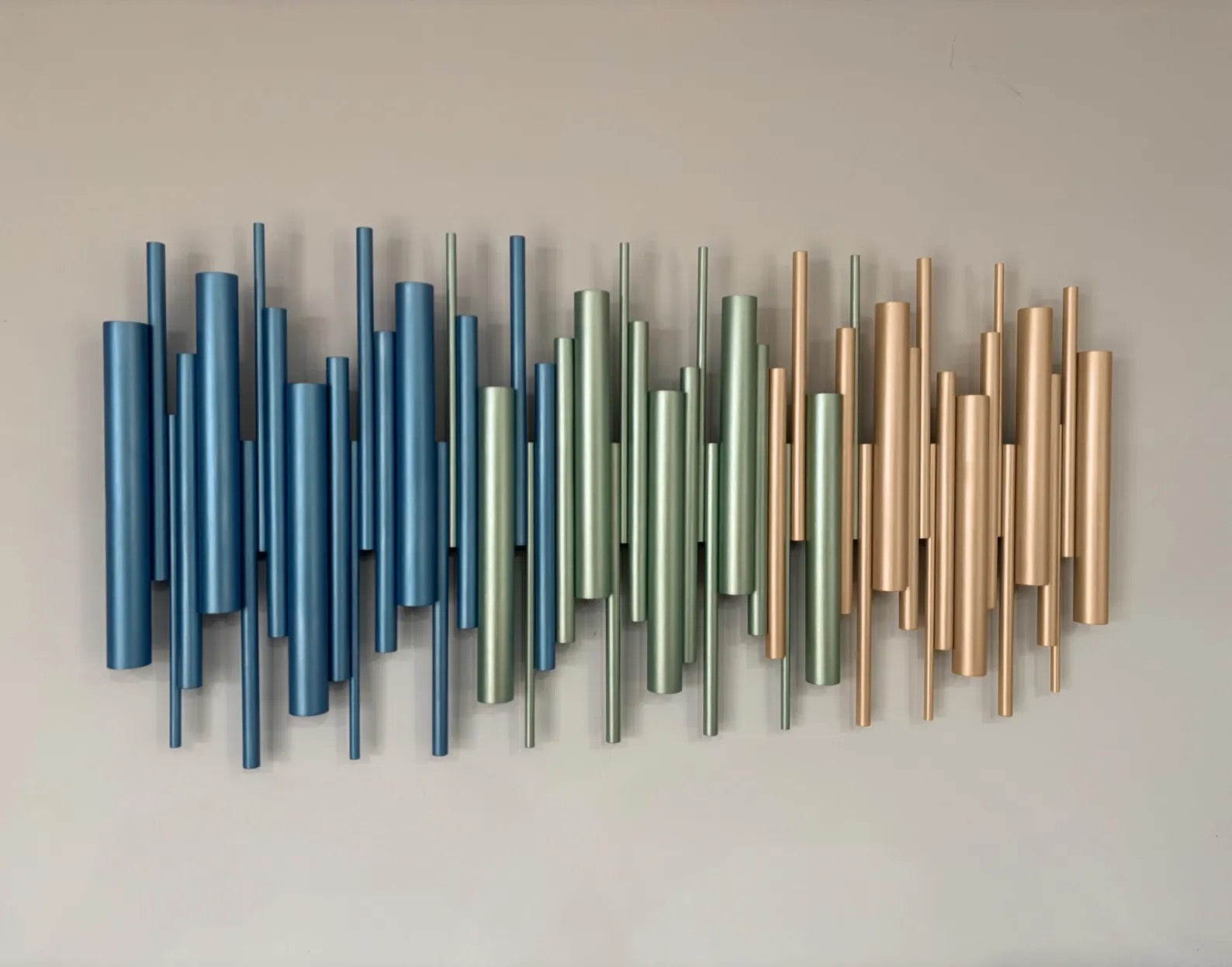 Azure wall art close up showing metallic blue and sage green wooden dowels – Berties Blocks