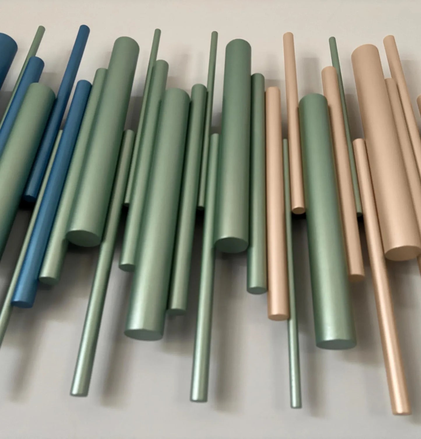 Azure wall art close up showing sage green and champagne gold wooden dowels – Berties Blocks