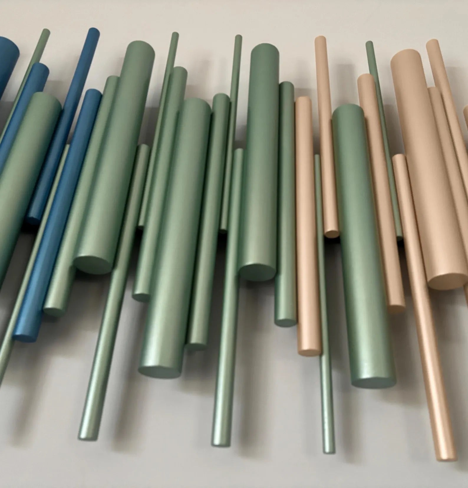 Azure wall art close up showing sage green and champagne gold wooden dowels – Berties Blocks