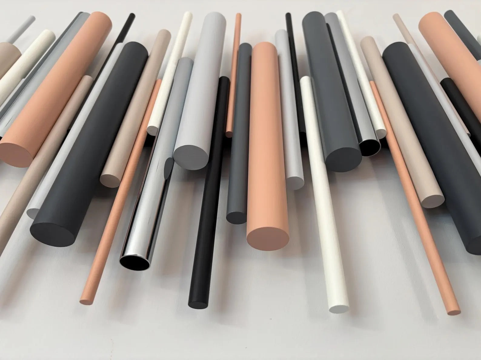 Cinder wall art close up detail showing black, beige and chrome wooden dowels – Berties Blocks