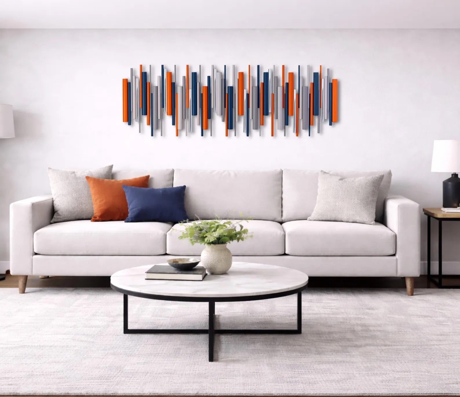 Solstice orange and blue wood wall art with chrome accents above sofa in living room – Berties Blocks